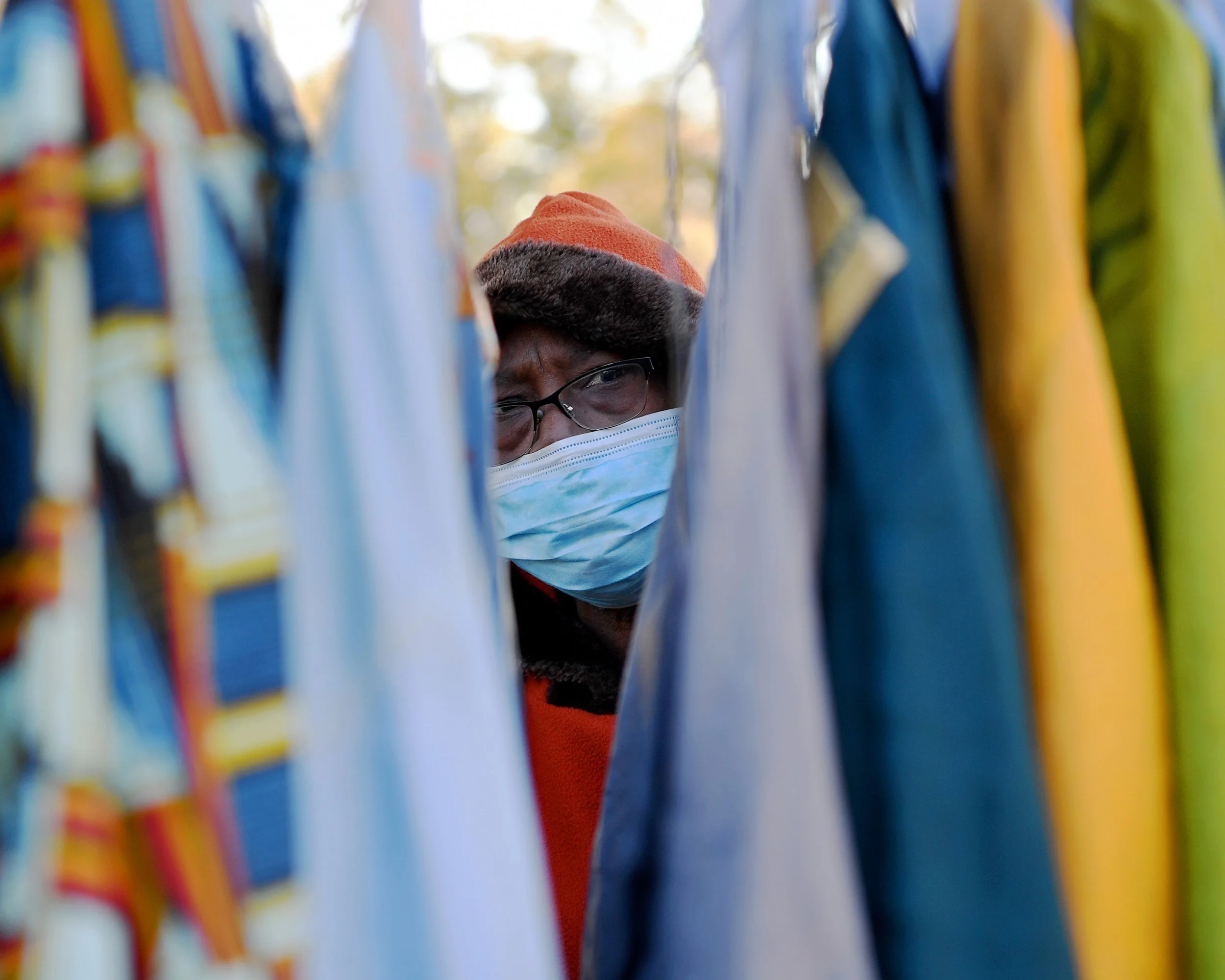  Margie Erving, adjusts traditional African clothing on display at the Martin Luther King Jr. Day Parade in Royal, on Monday, January 17, 2022.  
