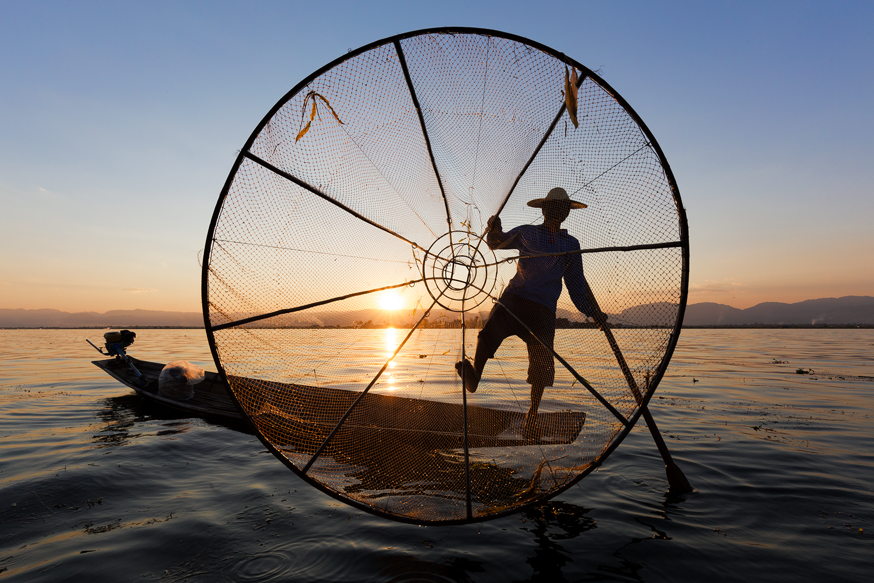 Fisherman_Silhouette_Net_Sunset.png