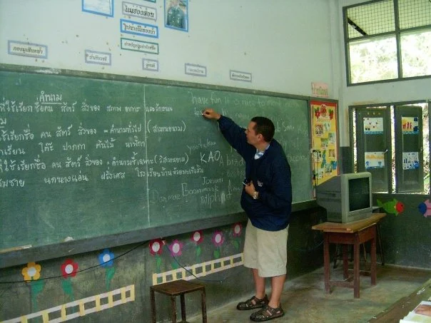 Ken teaching in Thailand at chalkboard.jpg