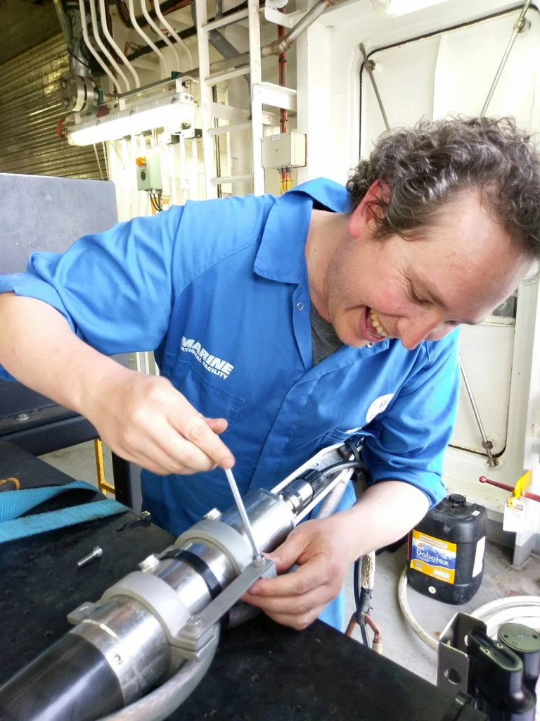 Aaron from SIT, testing out a custom-built beacon brace for the deep towed camera.