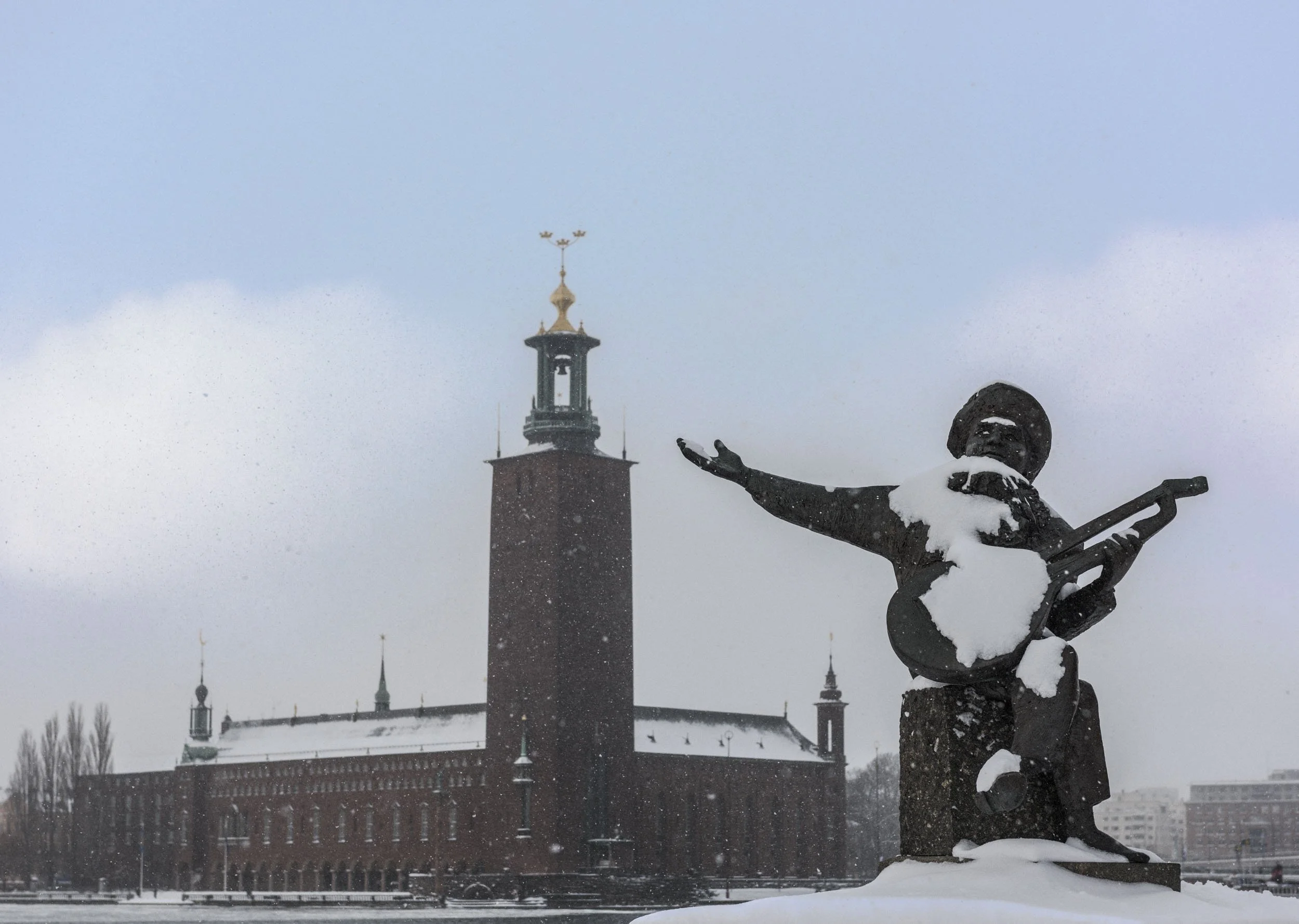 Stockholm City Hall and statue Evert Taube (troubadour)