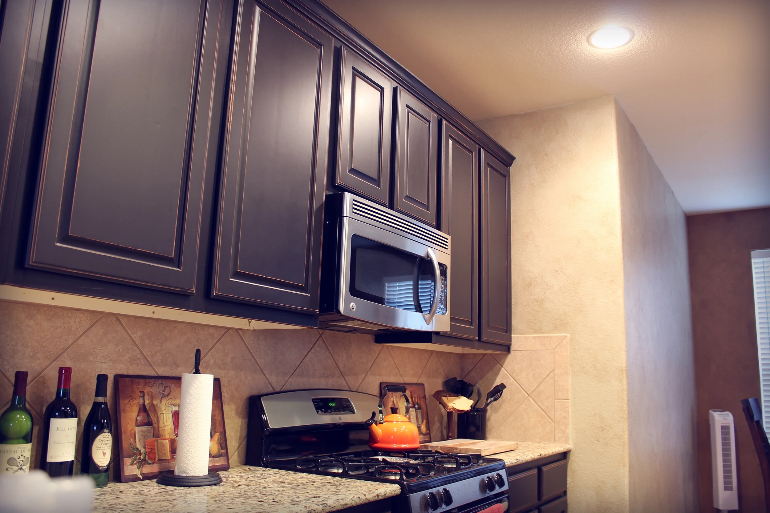 Satin Black Distressed Cabinets w/ Tobacco Glaze