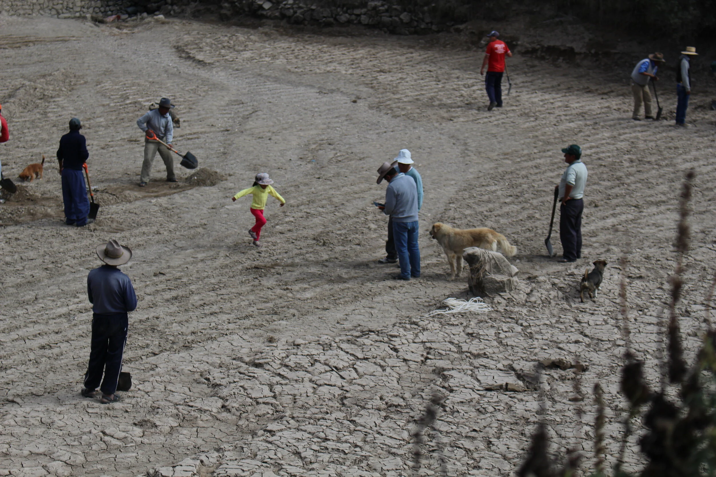communal labor to lift sediment out of the reservoir in Yanque, Peru