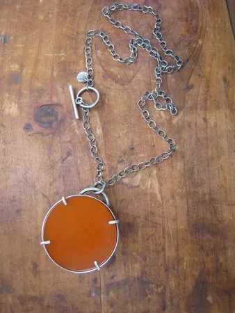 Double-sided bakelite necklace, pumpkin and dark green bakelite, prong settings, sterling silver chain, sold