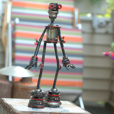 Remi, Castillo-class astrobot #234, repurposed bicycle parts,disc lock, wing nuts, rotating head, red racing stripes, 14½" x 8½" x 3", sold