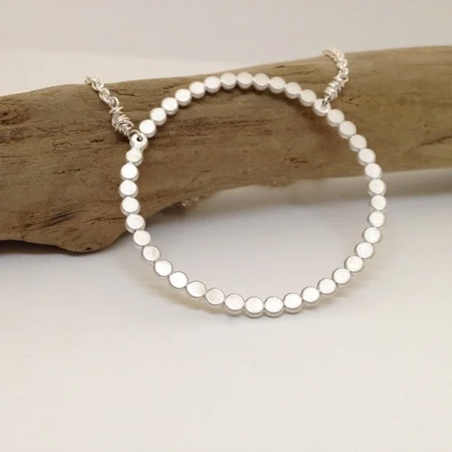 Itty-Bitty Dots Circle Pendant , sterling silver, $85