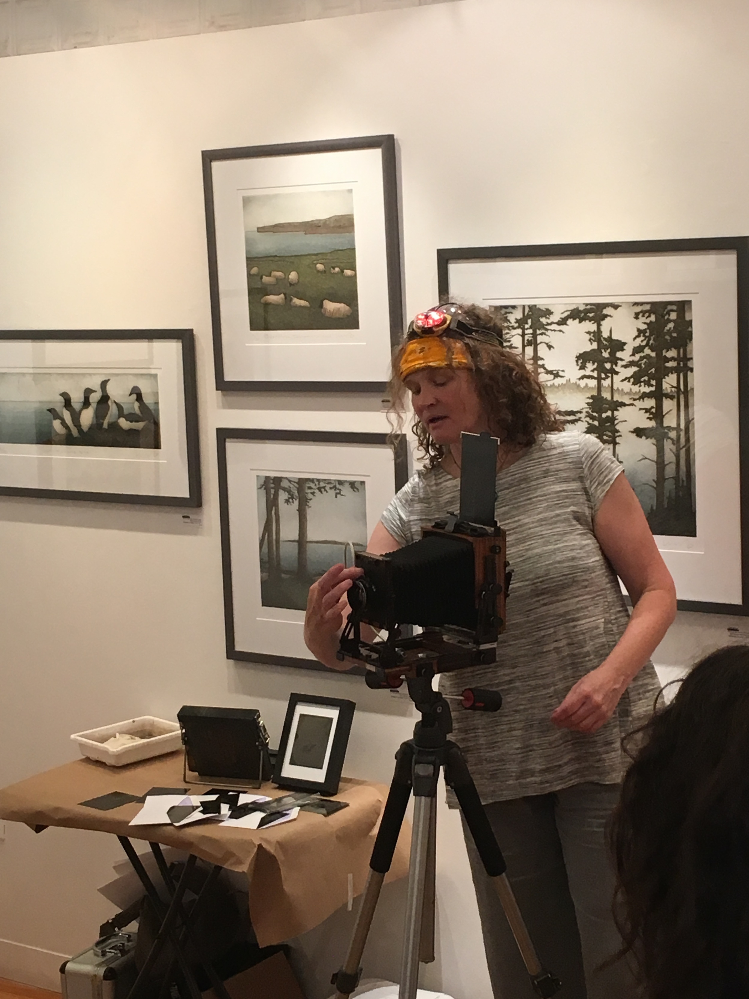  Silke Hase demonstrates various pieces of equipment used in the wet plate collodion process. 