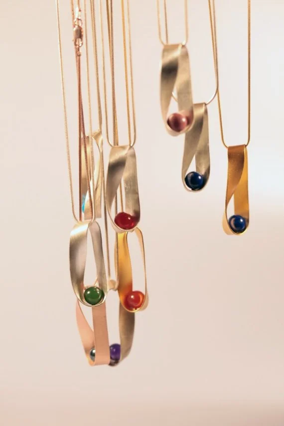 Mobius necklaces, assorted stones with sterling silver $110, with gold plate $130