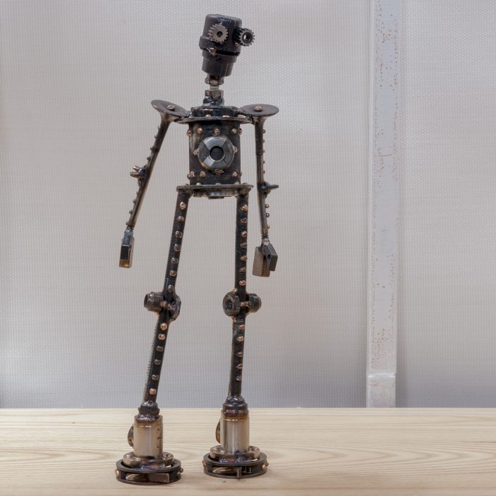 Ward #C295 , Castillo-class astrobot, bicycle parts, stainless steel valves, screws, piston valves, pipe caps, washers, bolts, nuts, wing nuts, copper, bronze, stainless steel, 14" x 5" x 3", sold