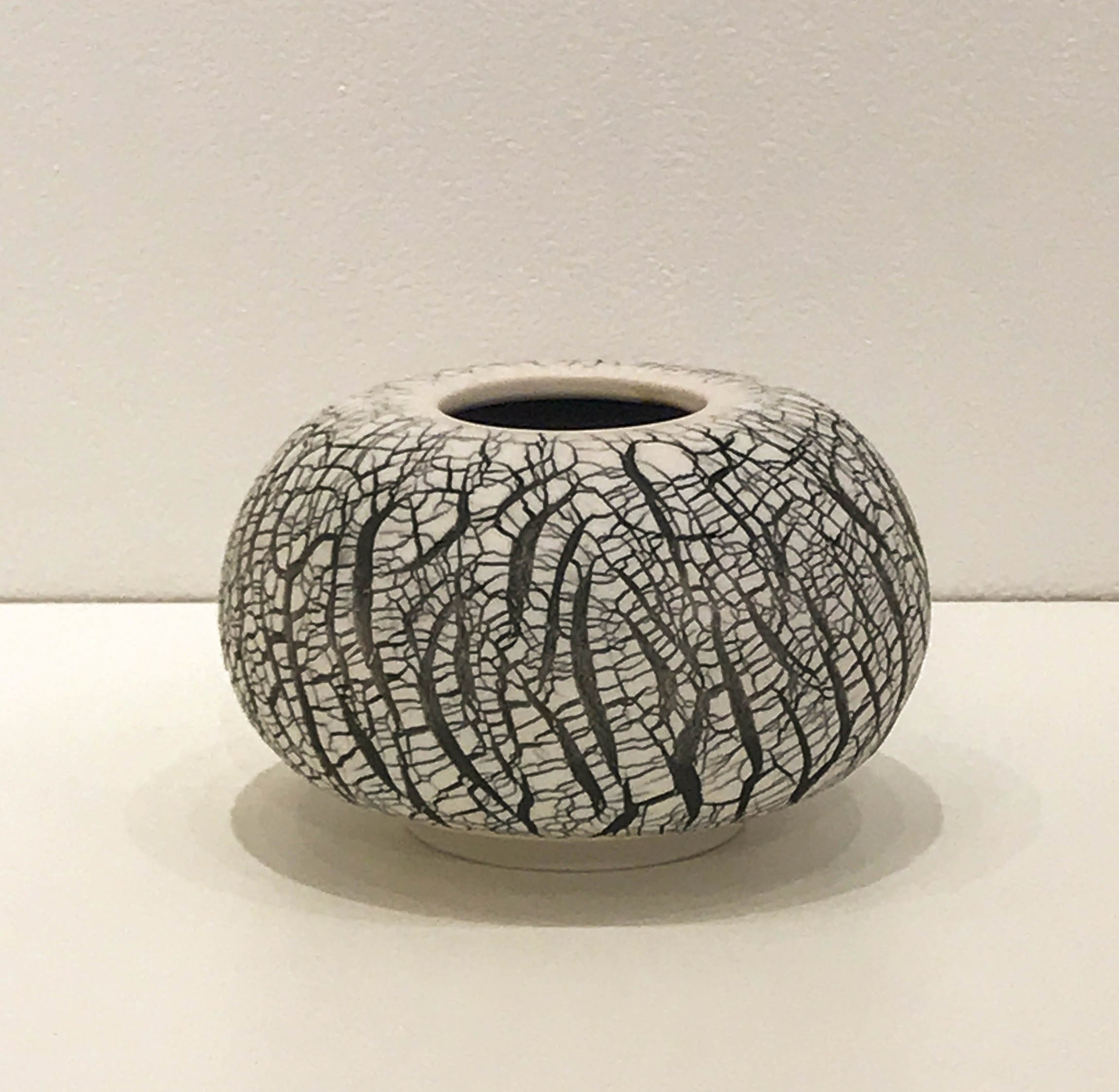 Small wheel-thrown and hand-altered sphere with black crackle, 4 1/4" x 4 1/4" x 2 1/2", $55
