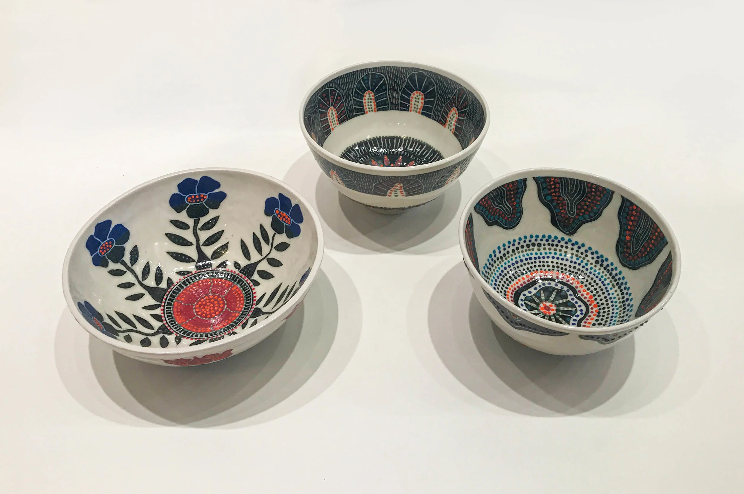 Sgraffito bowls, hand carved slip design on wheel thrown porcelain, $75 - $150