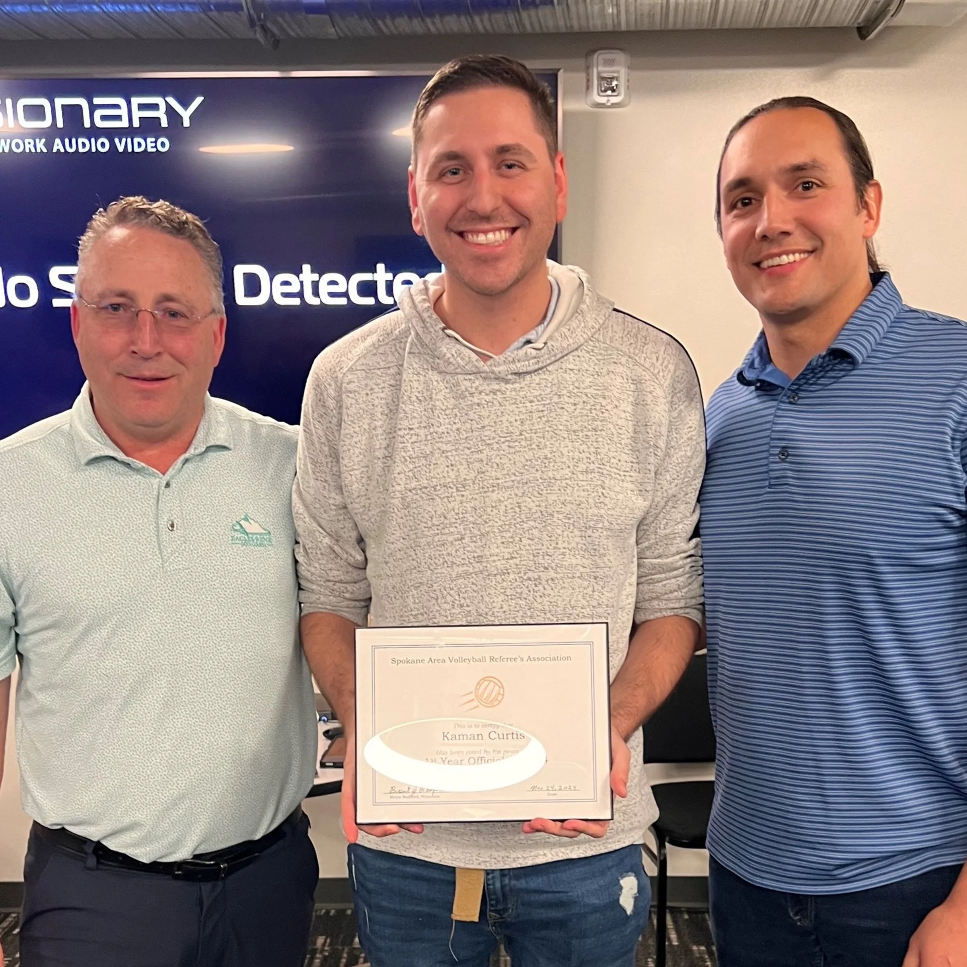 Awarded best first-year official was Kaman Curtis (center)