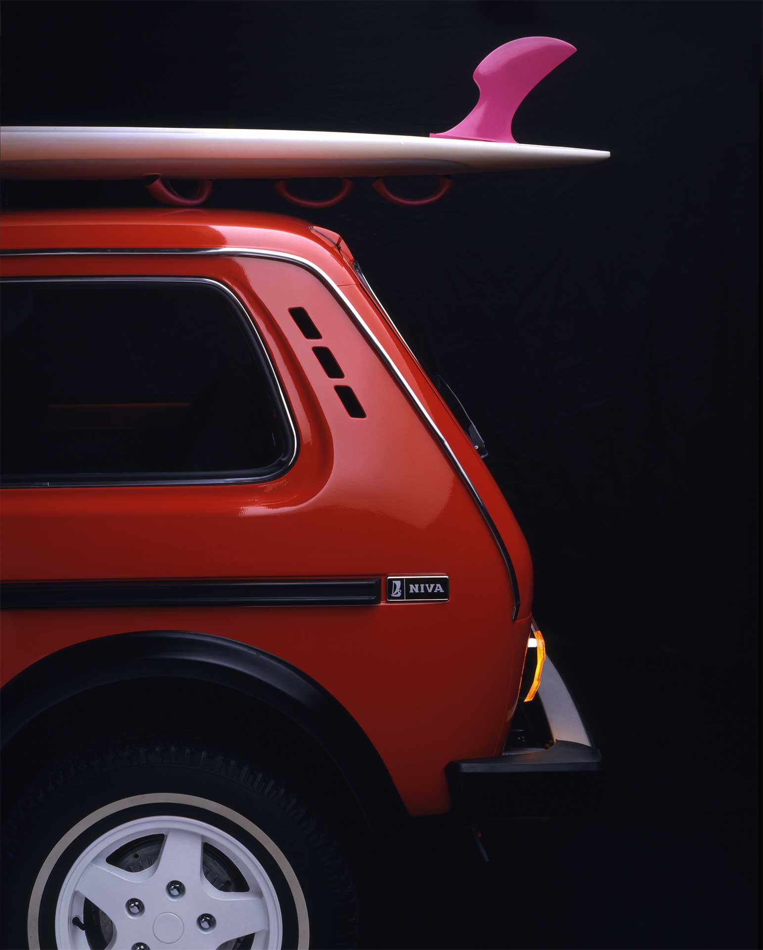 red_car_surfboard_scandinavian_ad_russian_auto_Lada.jpg