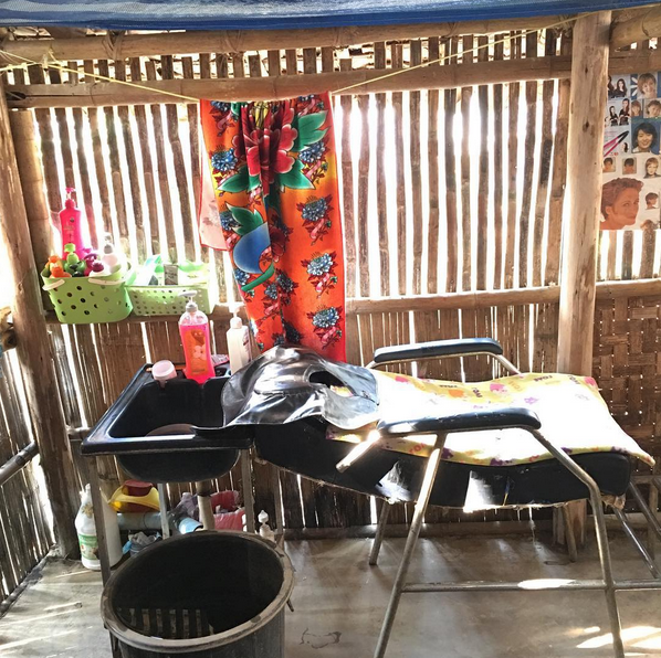 San Pyo uses a shampoo bed! The shampoo experience is an incredibly relaxing time for her clients, who are fellow refugees in the camps who all work very hard to create livelihoods for their families. She's excited to start doing the scalp and shoulder massage on her clients to make them feel even better.