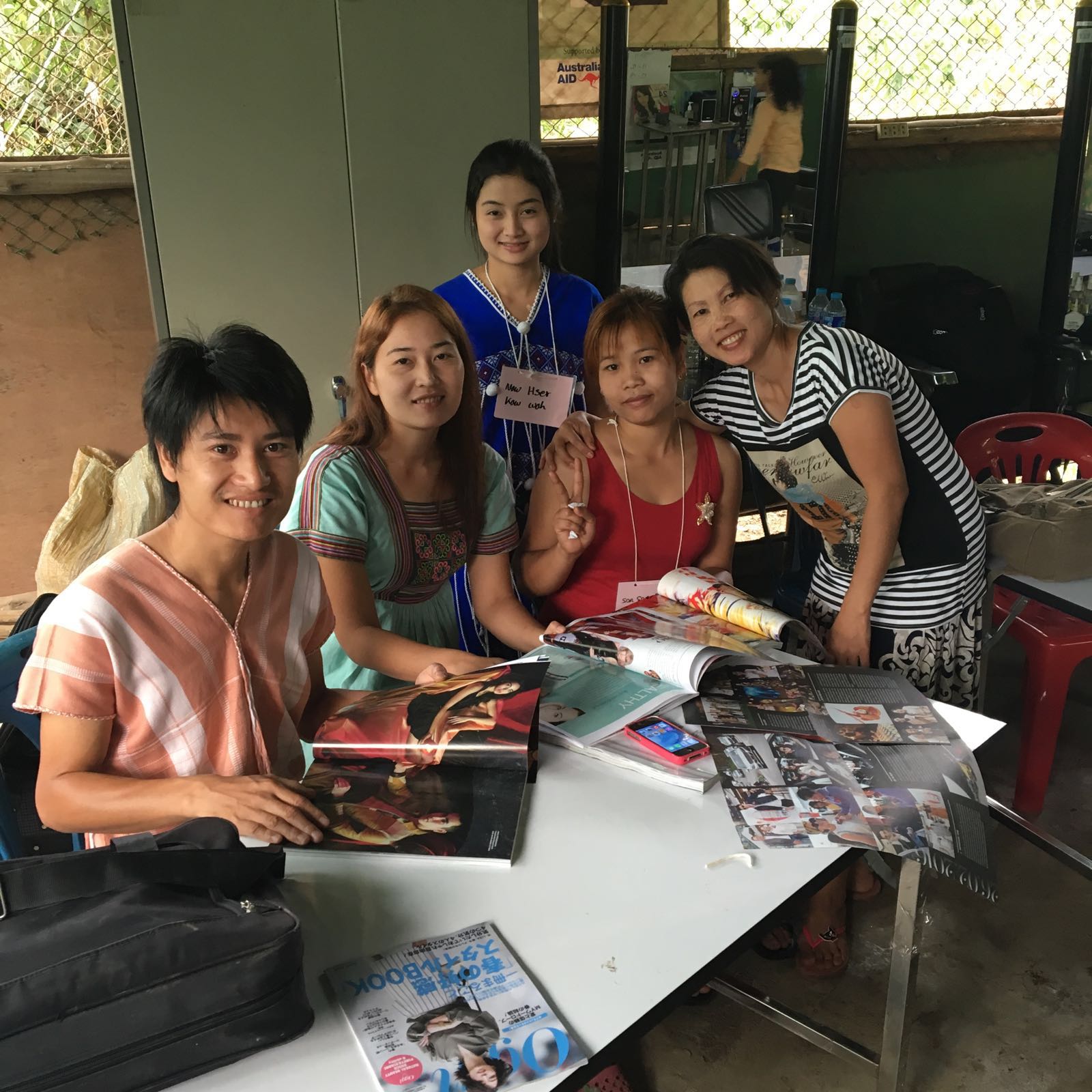 Paging through Thai magazines for inspiration.