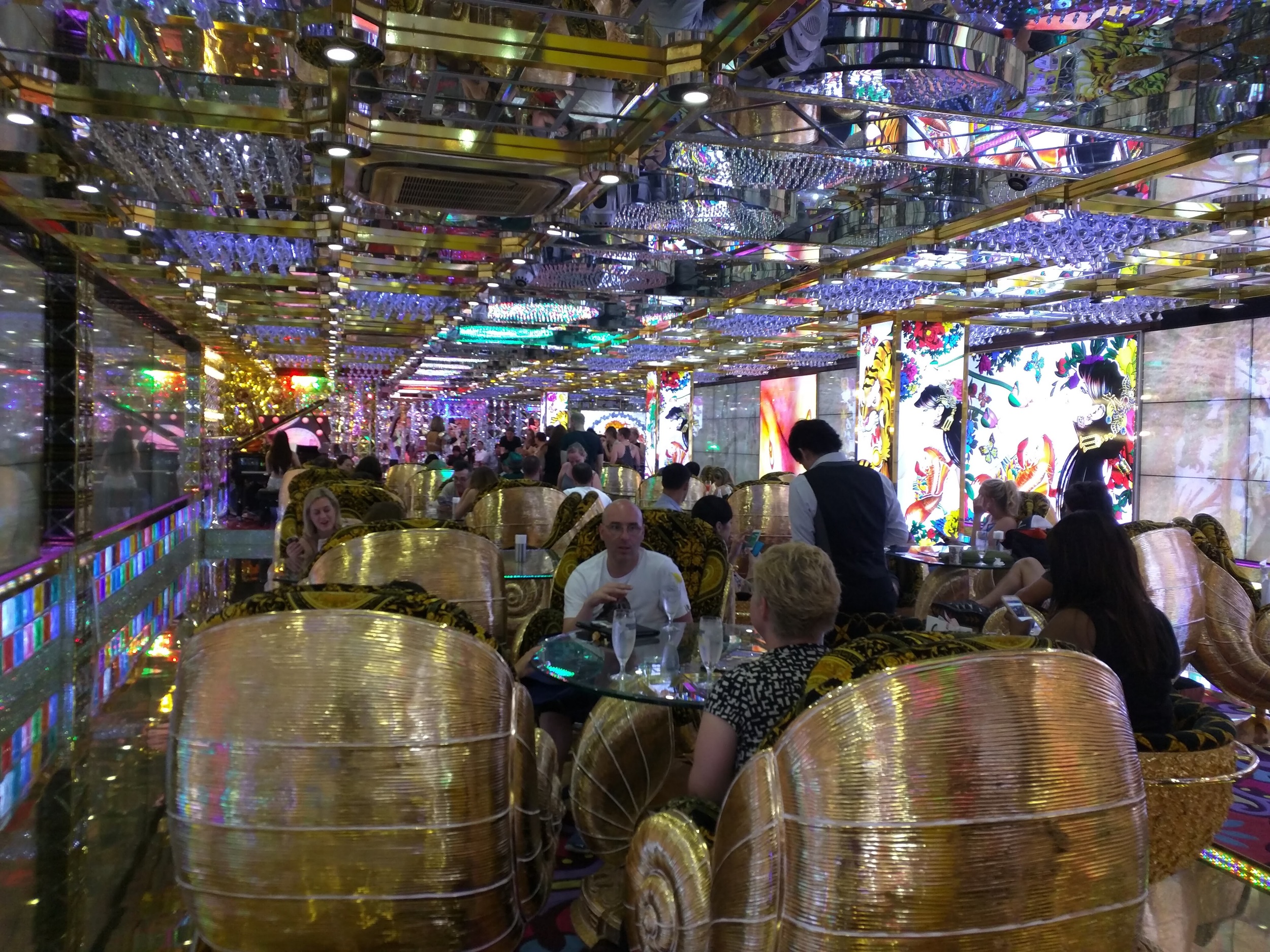 Psychedelic lounge full of, yes, golden snail's shells.