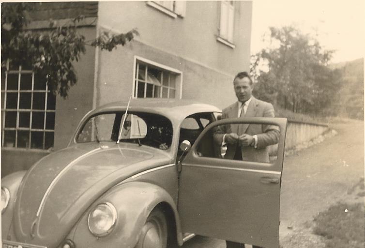  First company car, a VW Beatle, with company director and owner Helmut Lind , in the early 1950's 