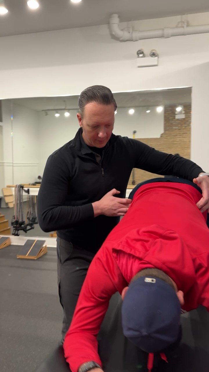 Dr. Adam Bruene working with an athlete