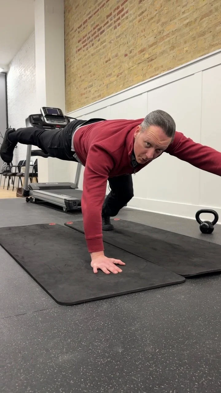 Dr. Adam Bruene demonstrating a Dynamic Neuromuscular Stabilization exercise