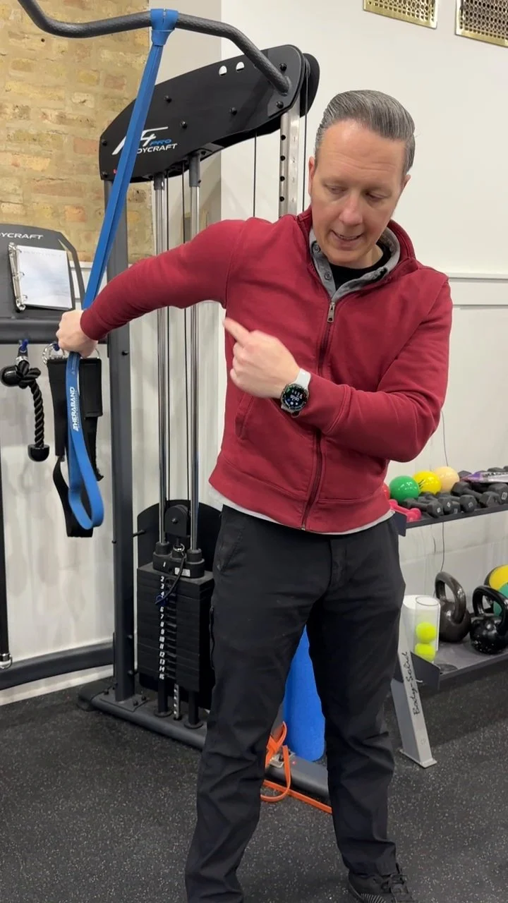 Dr. Adam Bruene assessing shoulder movement