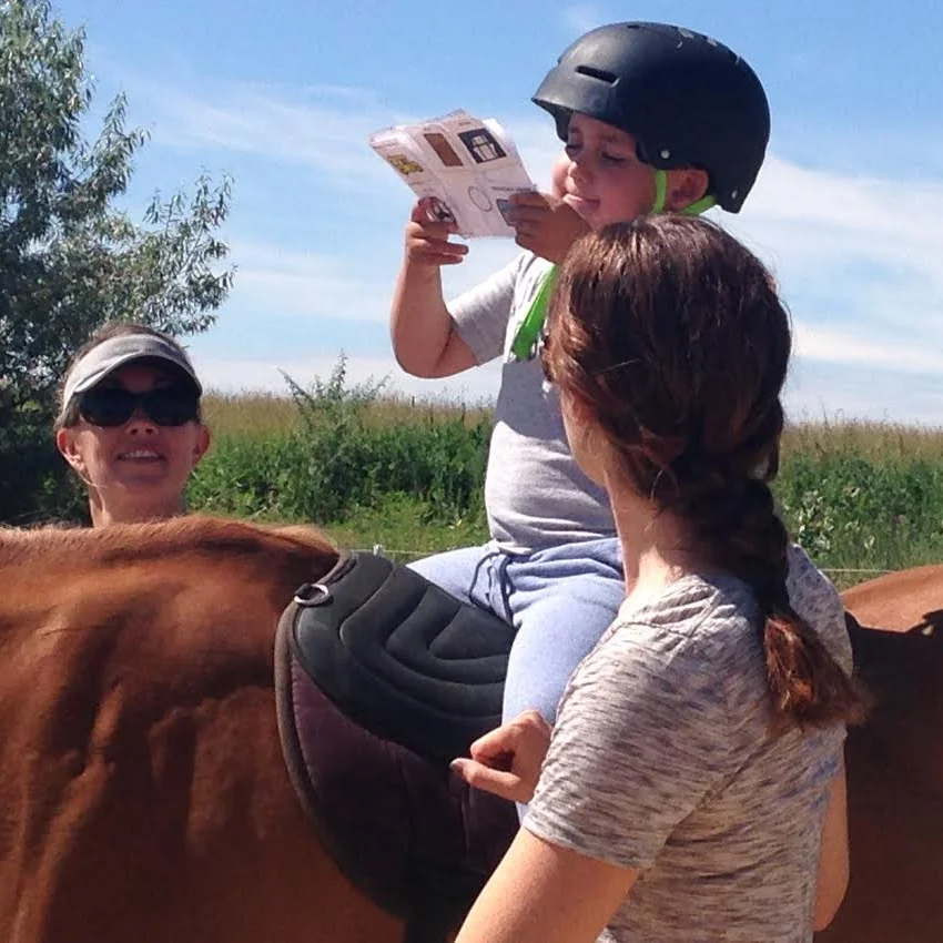 Cathy Lauderbaugh uses hippotherapy to incorporate motivating speech therapy activities into her private speech therapy sessions in Boulder County Colorado.