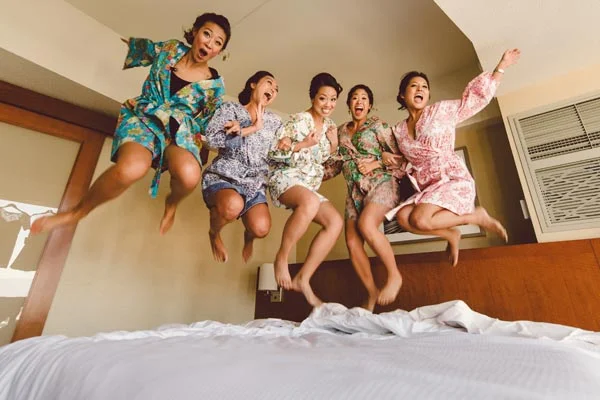 Do a throw back to your slumber party days with this carefree, jumping on the bed shot