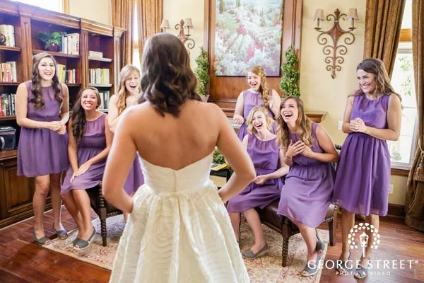 You will want to capture your girls' expressions the first time they see you on your wedding day. Be sure to get a 'reveal shot' with them