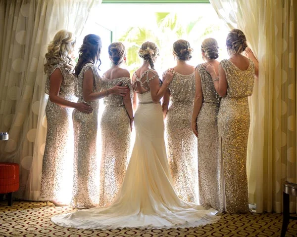 Don't forget to capture all of you from the back to showcase the back of the gowns. We love this shot which is silhouetted by the window