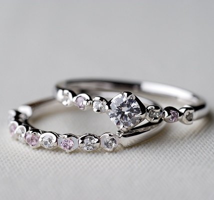 During the ceremony, you’ll want to leave your ring finger on your left hand free so your groom can slip on your wedding band. You can simply move your engagement ring to your right hand or have someone hold it for you until after your vows, when you can slip it back on for the reception. Remember: The band is usually worn closest to your heart on your left hand.