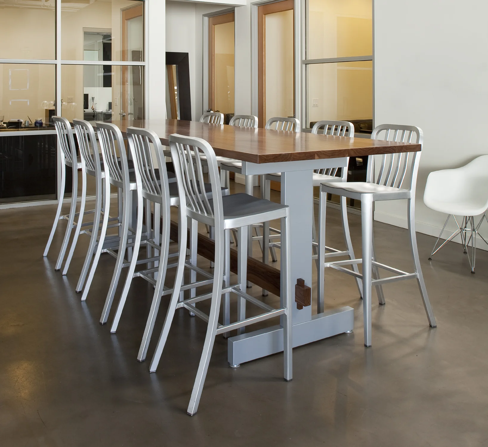   VIKING TABLE   Standing height conference table in solid American walnut and solid, powder coated aluminum. 