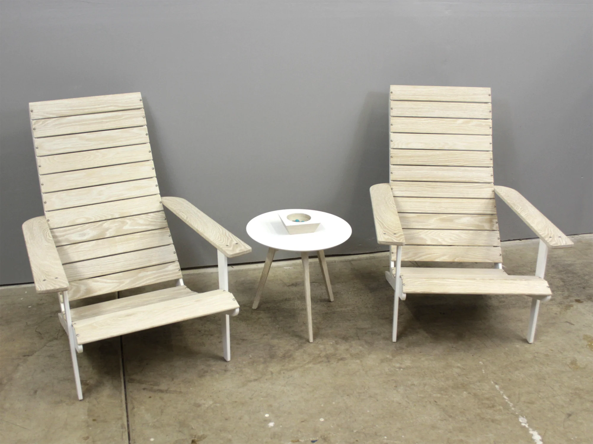   THE OUTDOOR CHAIR   Modern interpretation of a classic American Adirondack chair in bleached white oak and machined, powder coated aluminum. 