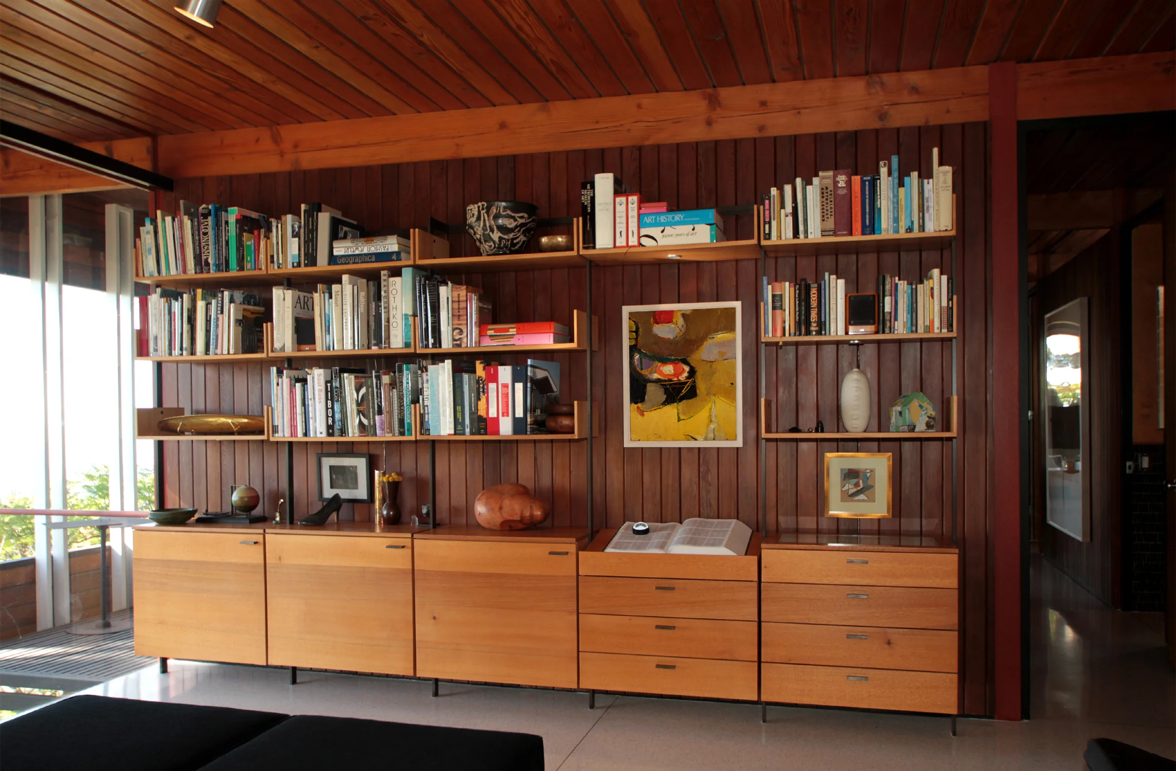   THE WALL UNIT   Modular wall unit in solid mahogany and machined, gun blued, cold rolled steel. 