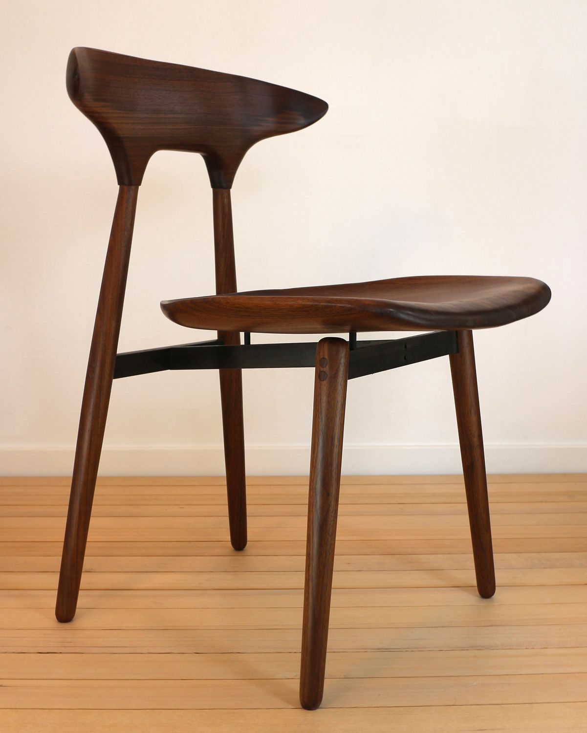   RD3 DINING CHAIR   An homage to my three favorite Danish designers, Hans Wegner, Finn Juhl, and Poul Kjærholm. It is made of solid, steam-bent walnut and gun-blued steel. 