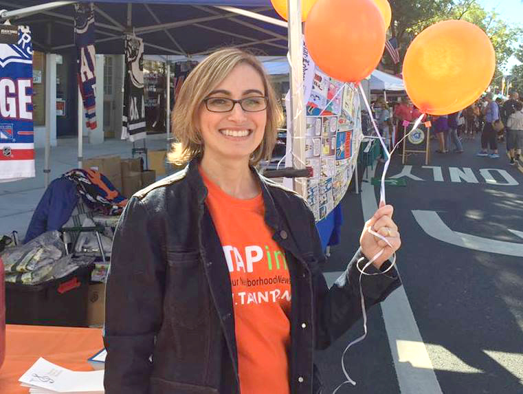 At the TAPinto booth at the Festifall Street Fair.