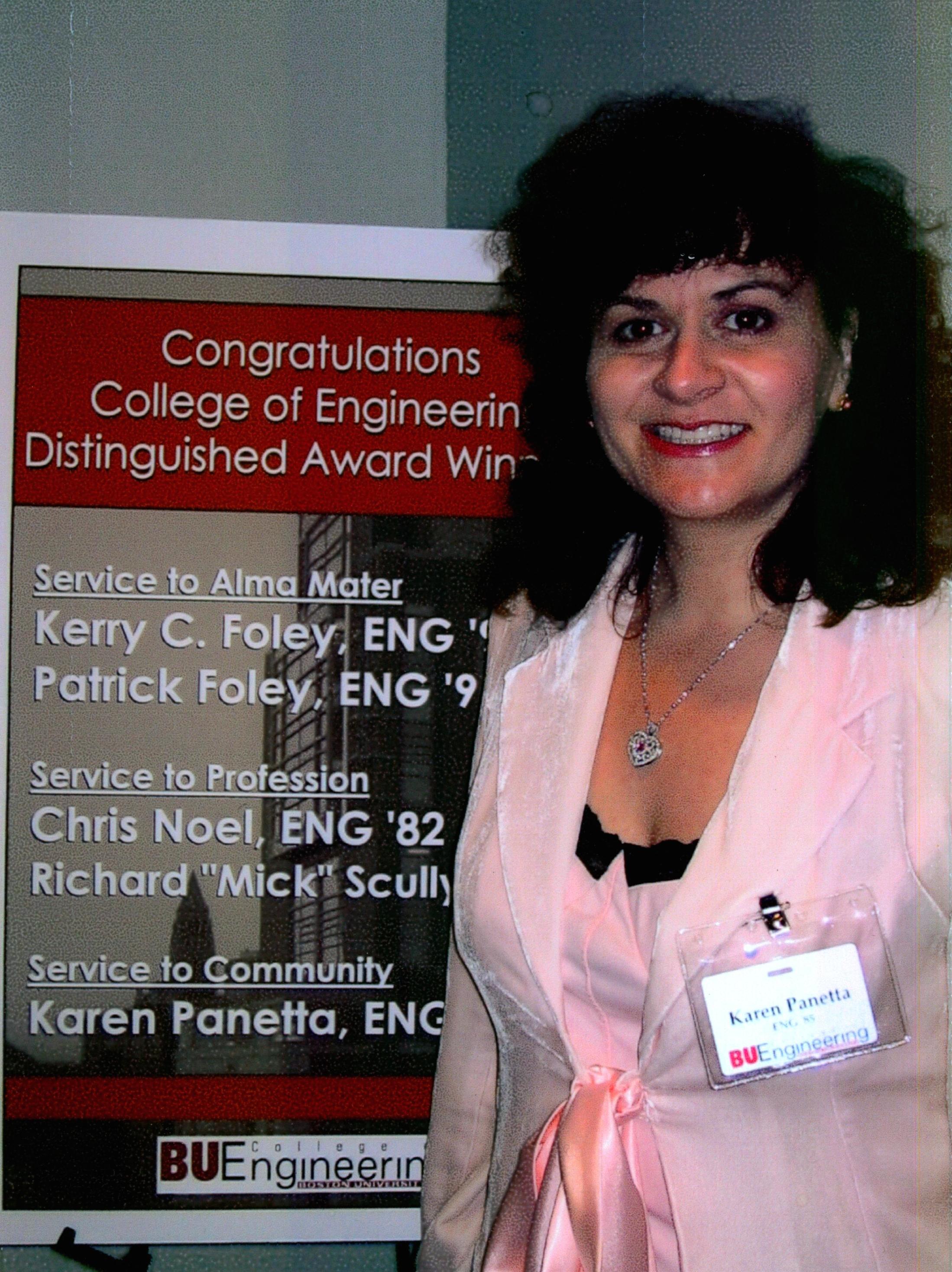 Karen getting her alumni award from Boston University