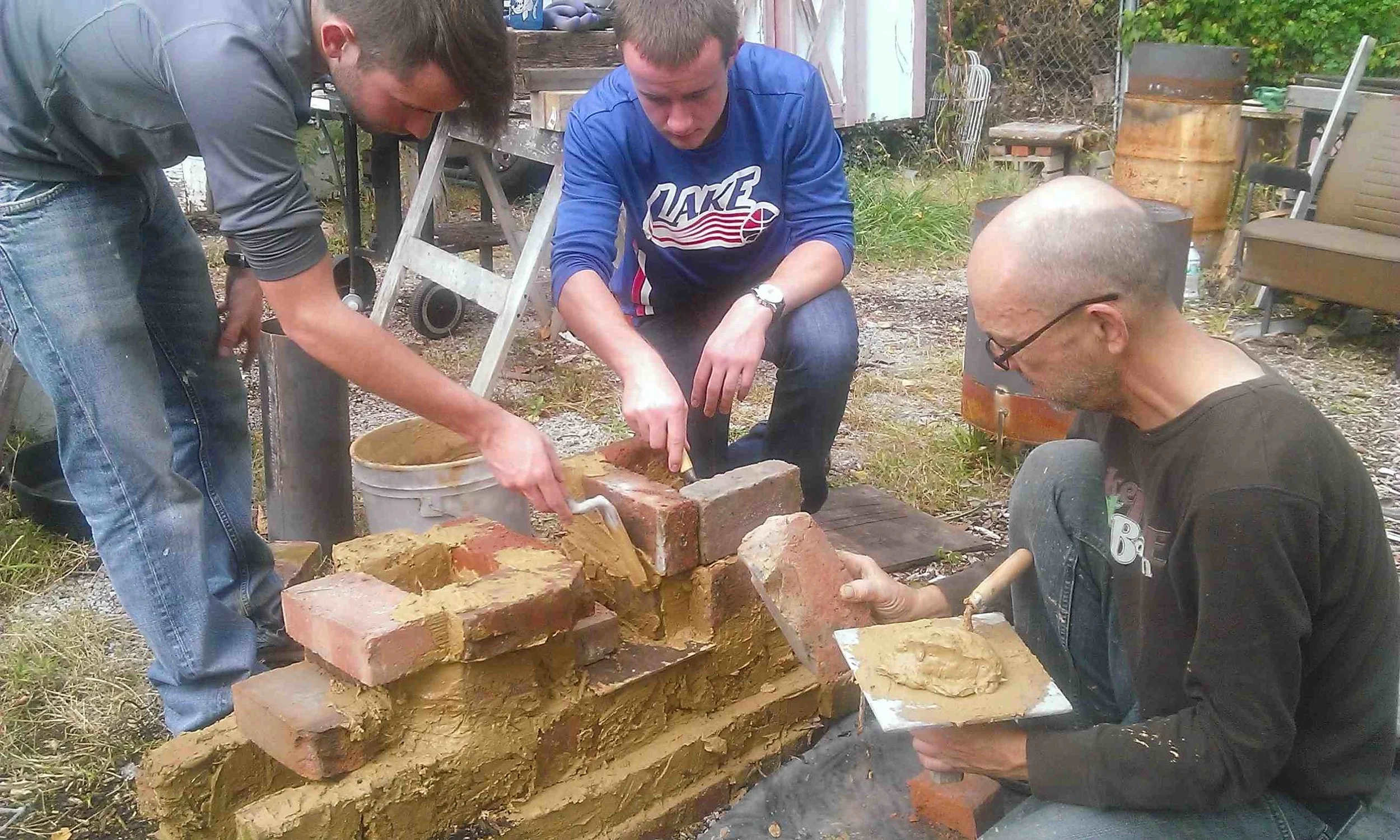 Students from a Custom International Development Training, learning how to build a Rocket Mass Heater, the most efficient, economical and renewable source of heating yet developed. This class was geared towards their 6 month long Mennonite Sustainable Development Mission in Rural Morocco. 
