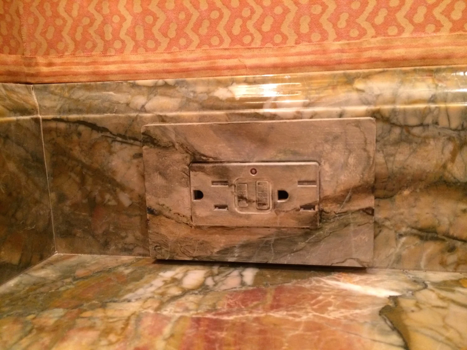   ELECTRIC OUTLET PAINTED TO MATCH MARBLE  