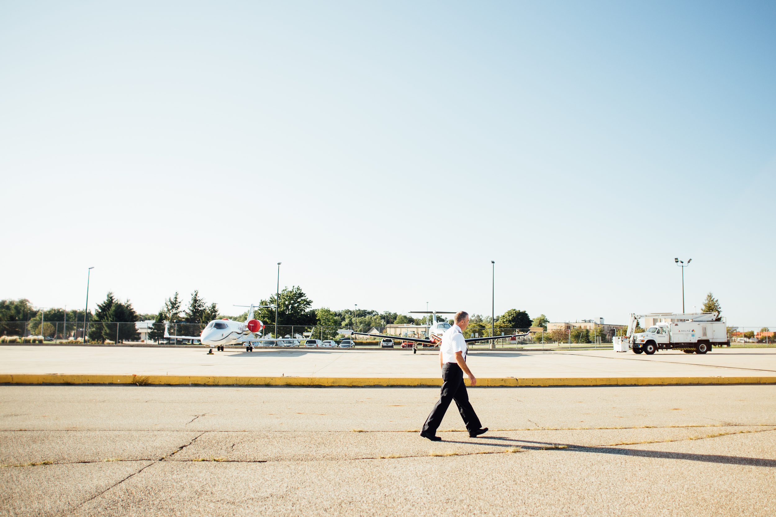pilot walking runway at Kalamazoo International Airport