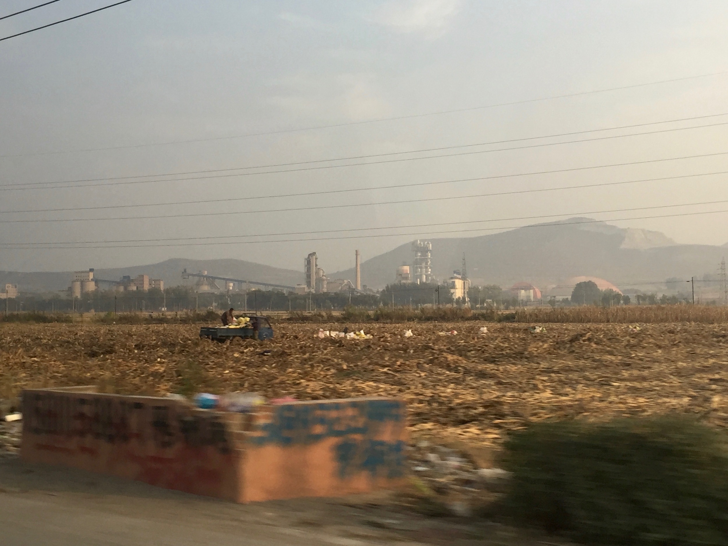 Corn is a staple in the north. They dry it out and use it as fuel to heat their homes. This was the harvesting and drying season. There was corn everywhere. They would even lay it out on the roads to dry it out and cars would just drive over it. 
