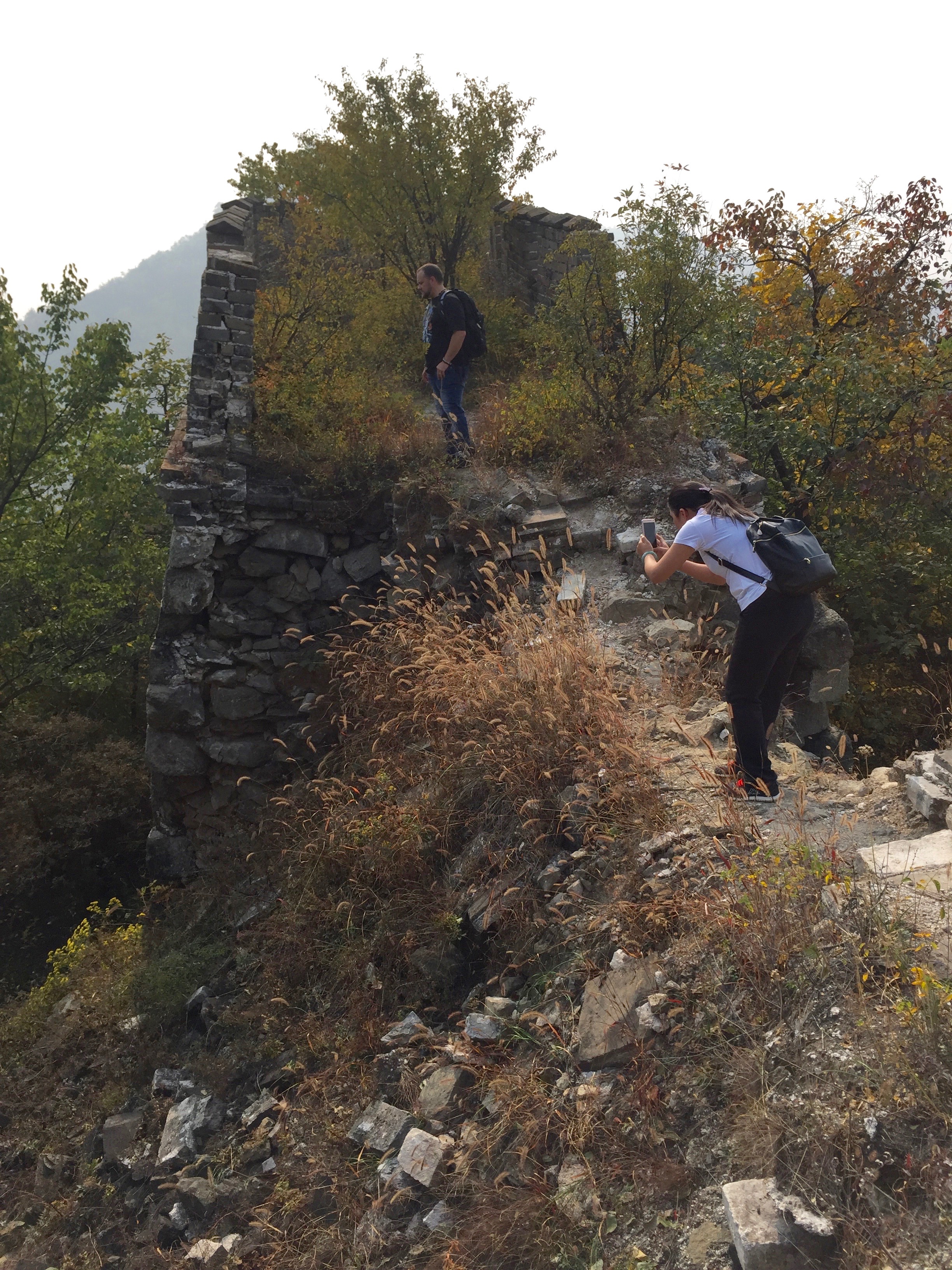 Heading off the beaten path to the unrestored part of the wall. 