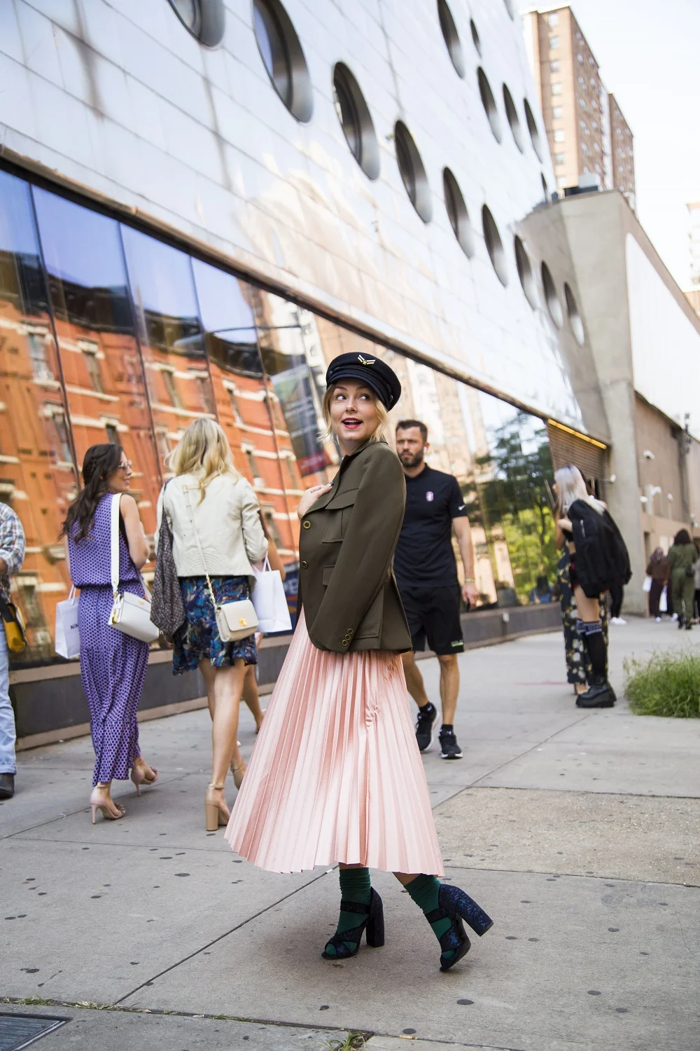 The structured jacket and hat are a perfect contrast to this soft pink feminine skirt.