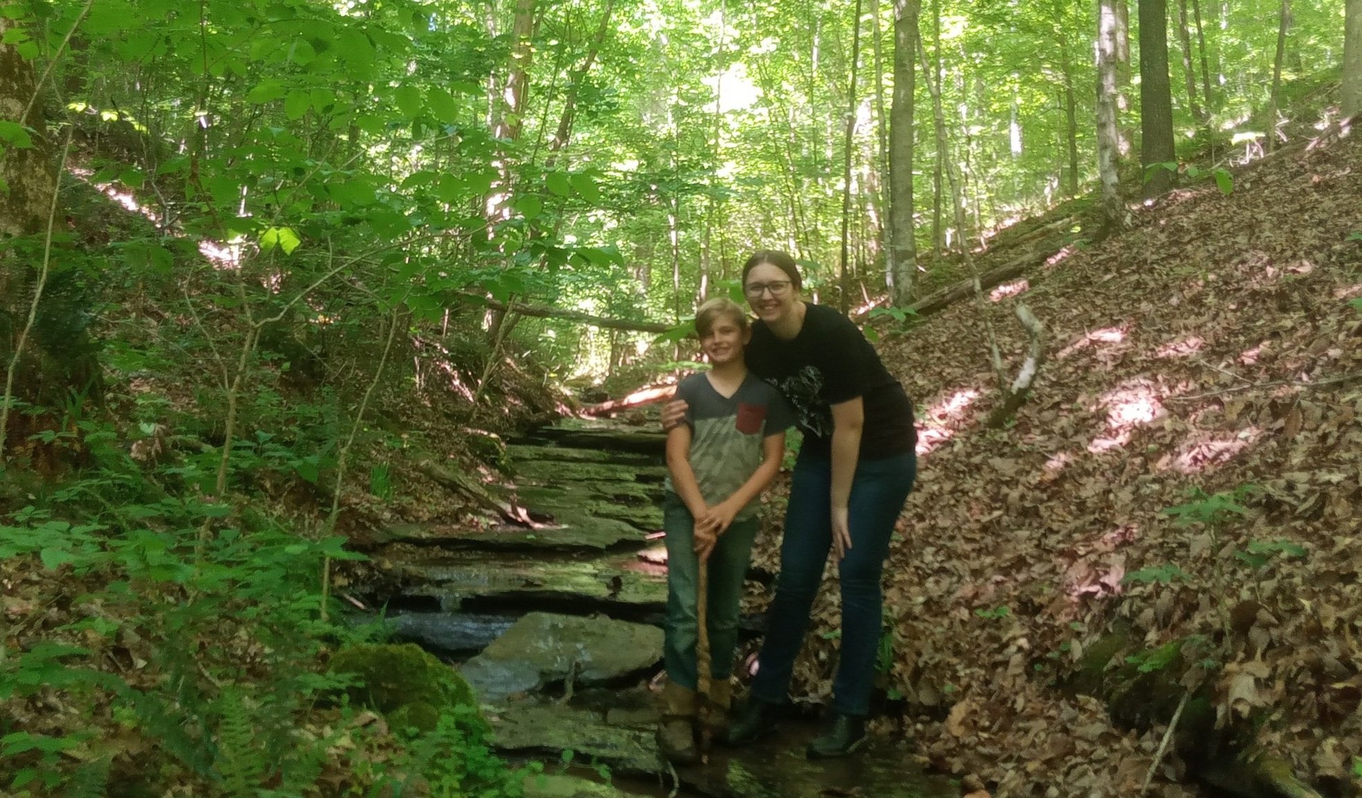  Before he leads us up a steep slippery slop next to a possible fox den to find the spring. 