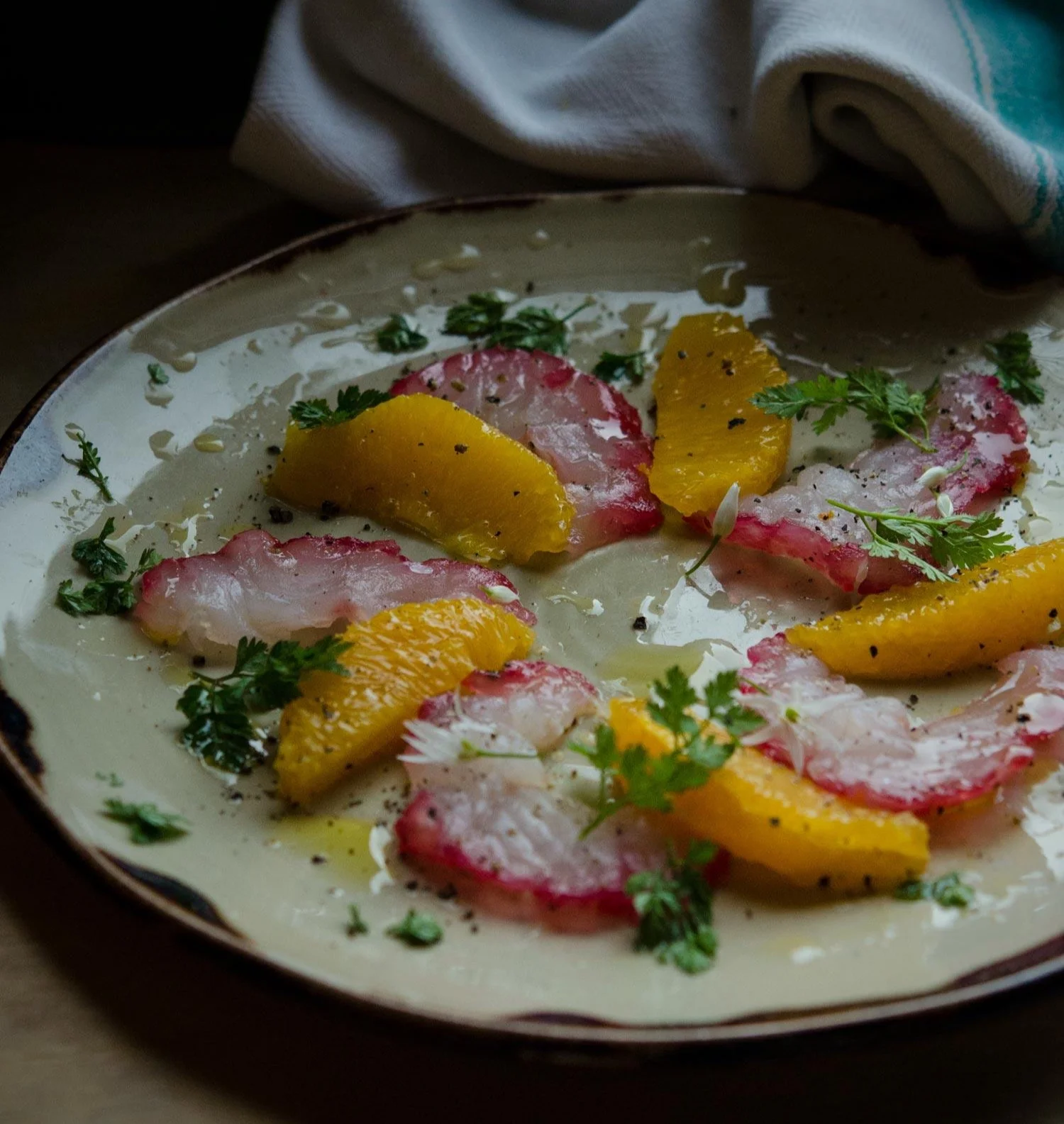 Beetroot and Orange cured pollock with orange segments and chervil