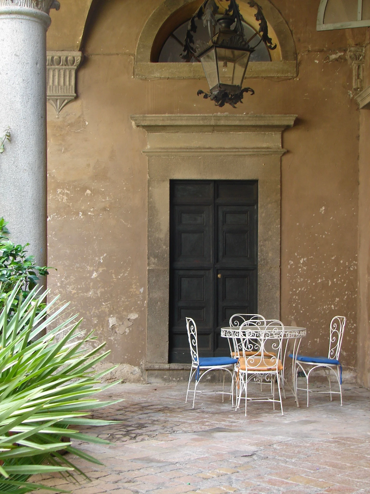 Little outdoor table in front of door to chapel