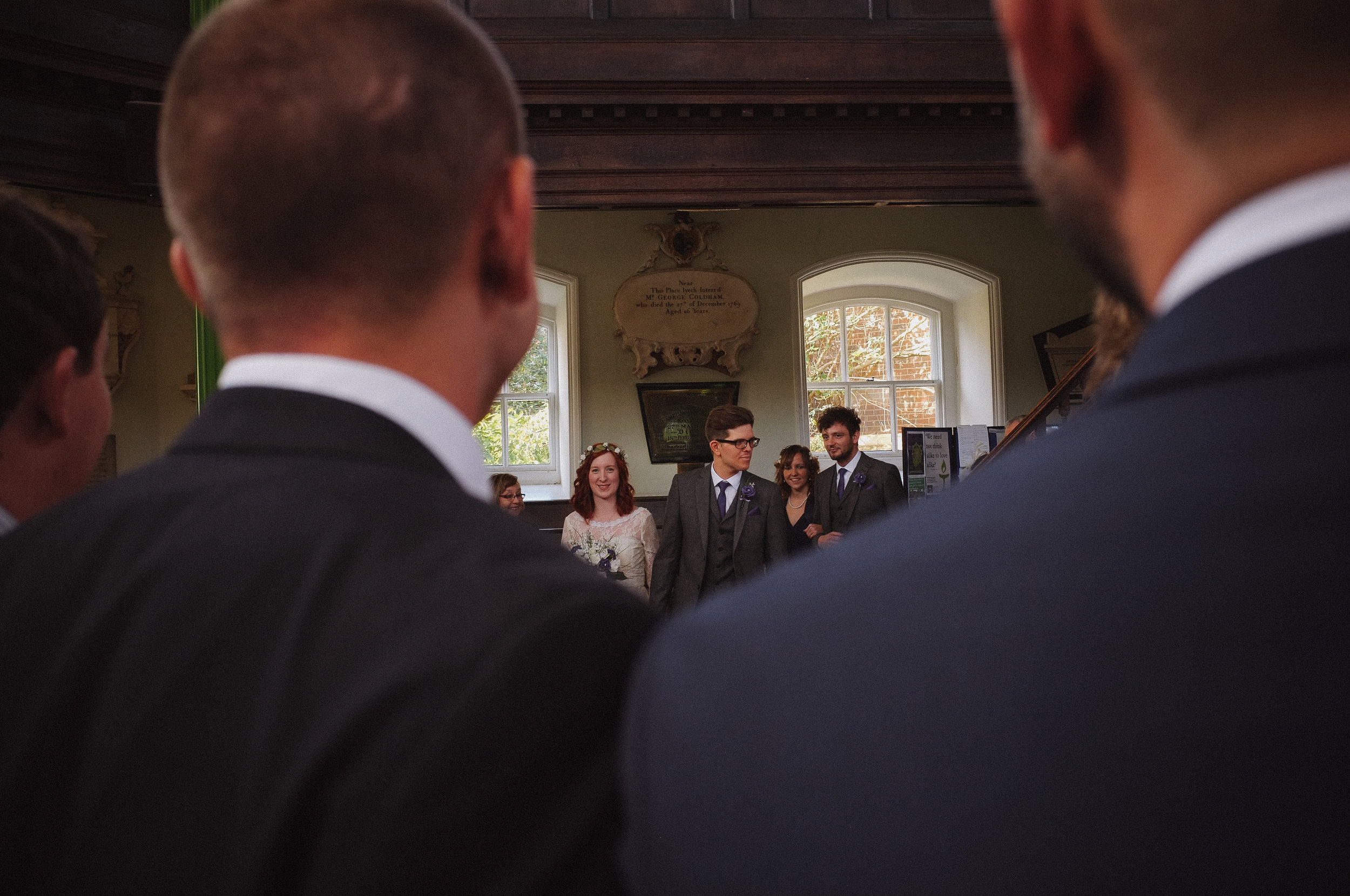 Married couple walking down the aisle at Octagon chapel norwich