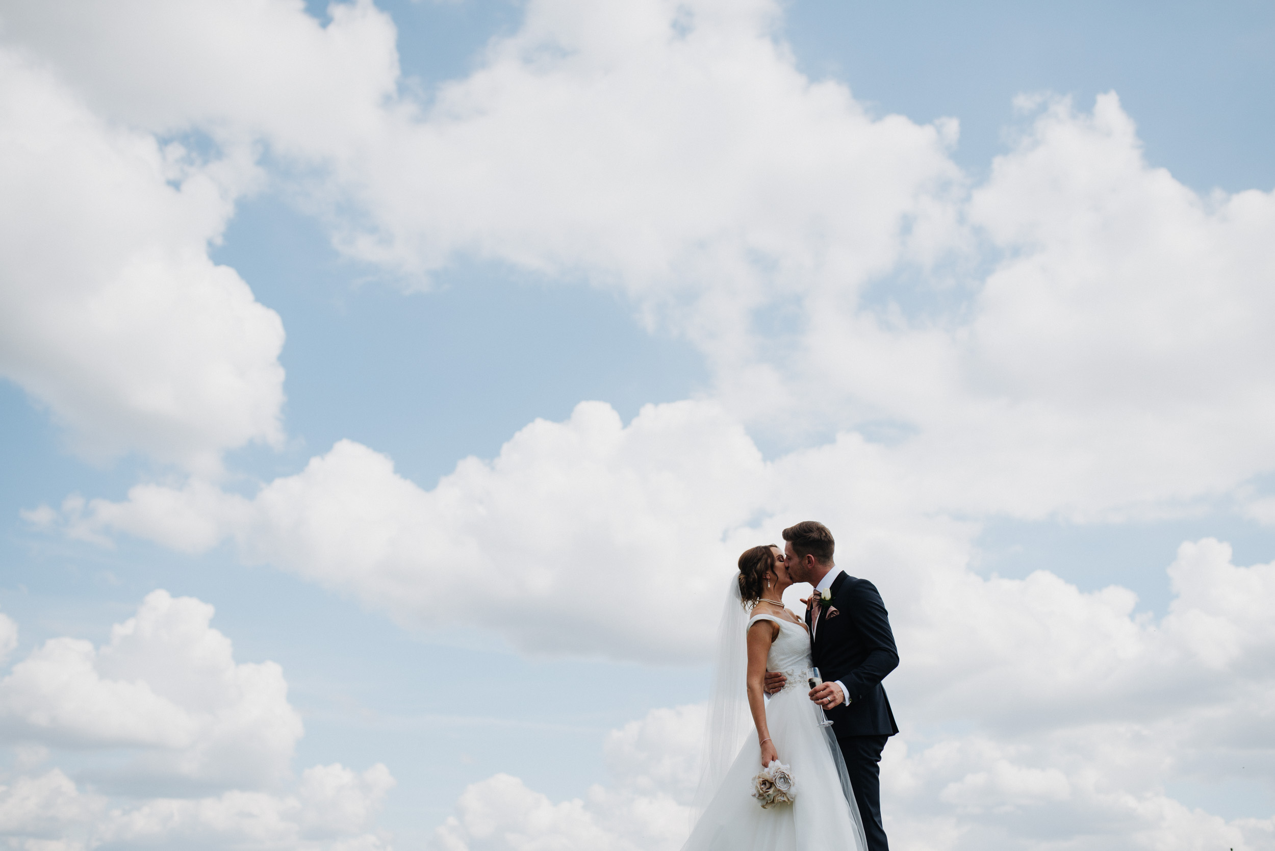 married couple portrait shoot in the clouds