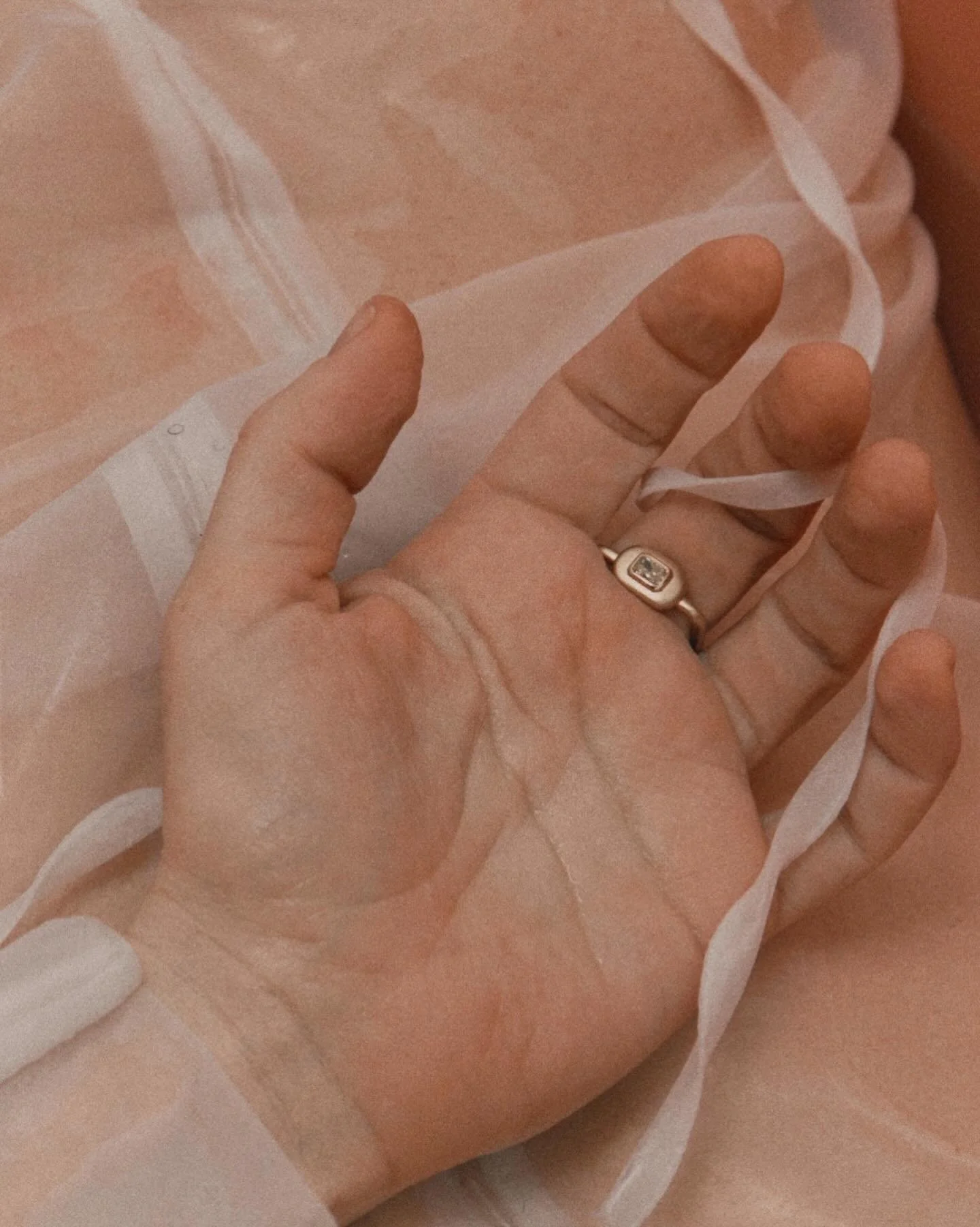 Bun Number Two Ring, with a &lsquo;U&rsquo; shape band and solid pillow of gold to seat a glittering, pale yellow, radiant cut diamond. Referencing the fluidity and form of 1970s shapes, from a contemporary viewpoint.