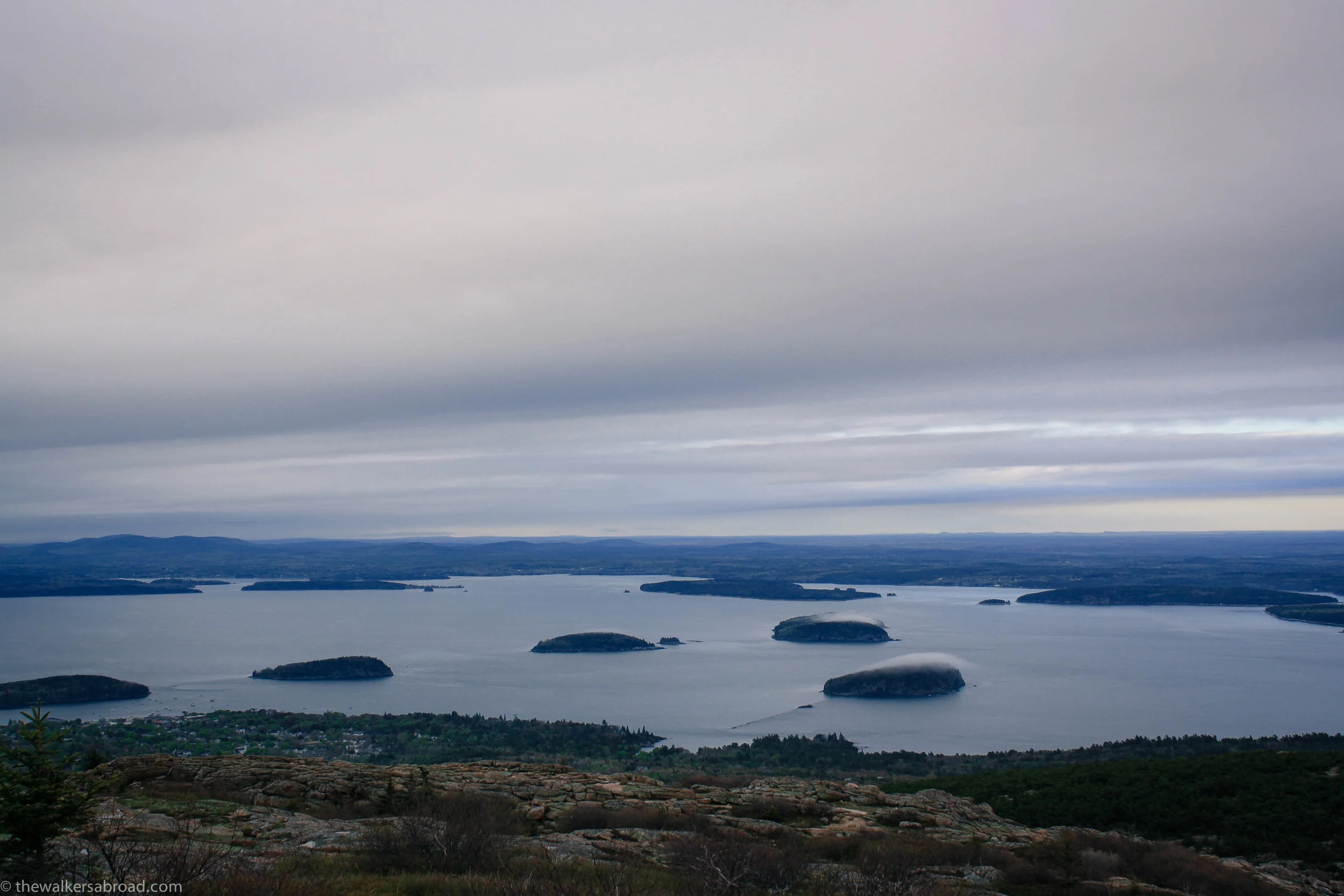 The small islands in Frenchman's Bay are known as the Porcupine Islands. This was taken on a cool evening, just as the fog was tapering off. I love the remnants of the fog just hovering over those two islands. 