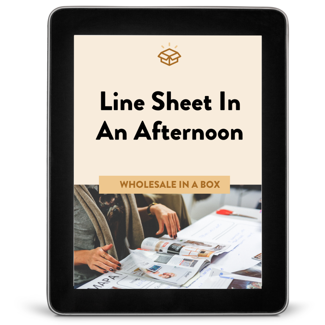 E-book cover titled 'Line Sheet In An Afternoon,' with a subtitle 'Wholesale In A Box,' featuring a photo of people looking at catalogs or magazines at a table.