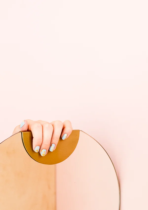 amelia-lawrence-photo-hand-on-mirror-gold-foil-nails-1-2.jpeg